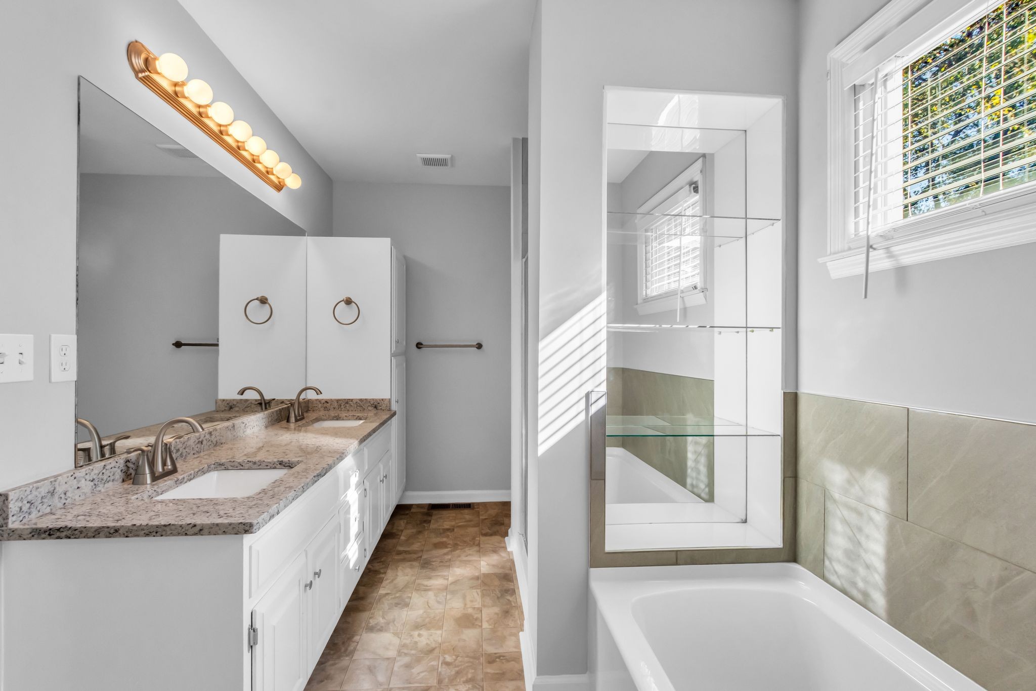 2560 Choctaw Trace Murfreesboro, TN 37129 - Photo 23 of 36 a bathroom with a granite countertop sink and a mirror