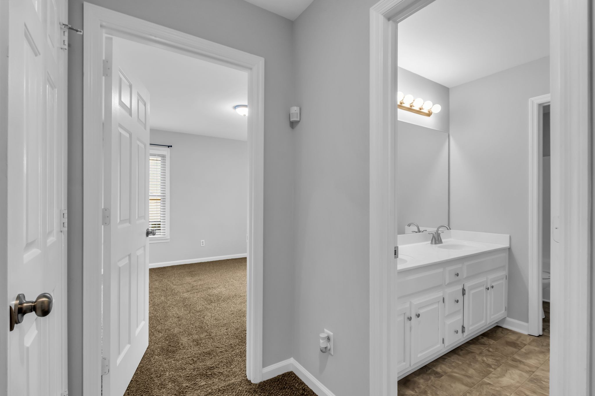 2560 Choctaw Trace Murfreesboro, TN 37129 - Photo 28 of 36 a bathroom with a double vanity sink and mirror