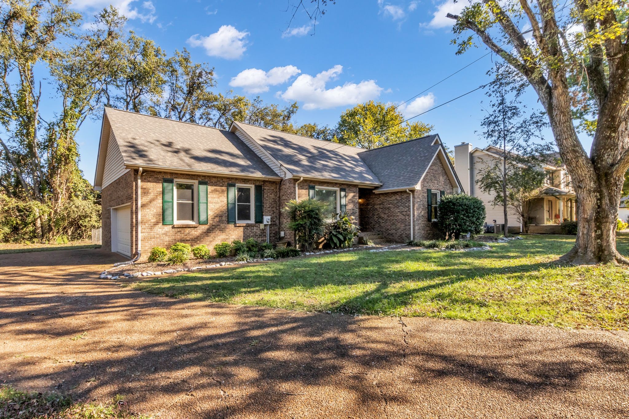 2560 Choctaw Trace Murfreesboro, TN 37129 - Photo 3 of 36 a front view of a house with a garden and trees