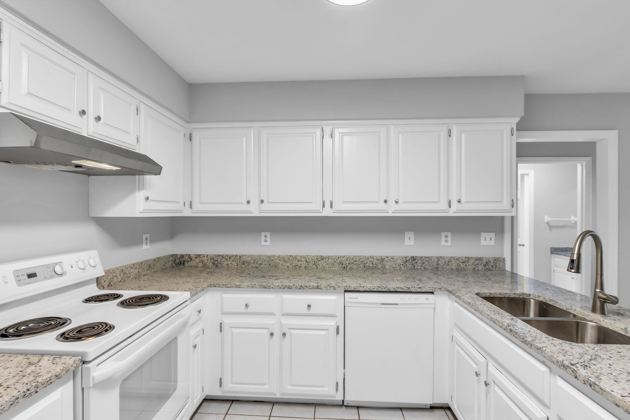 2560 Choctaw Trace Murfreesboro, TN 37129 - Photo 8 of 36 a kitchen with granite countertop white cabinets and white appliances