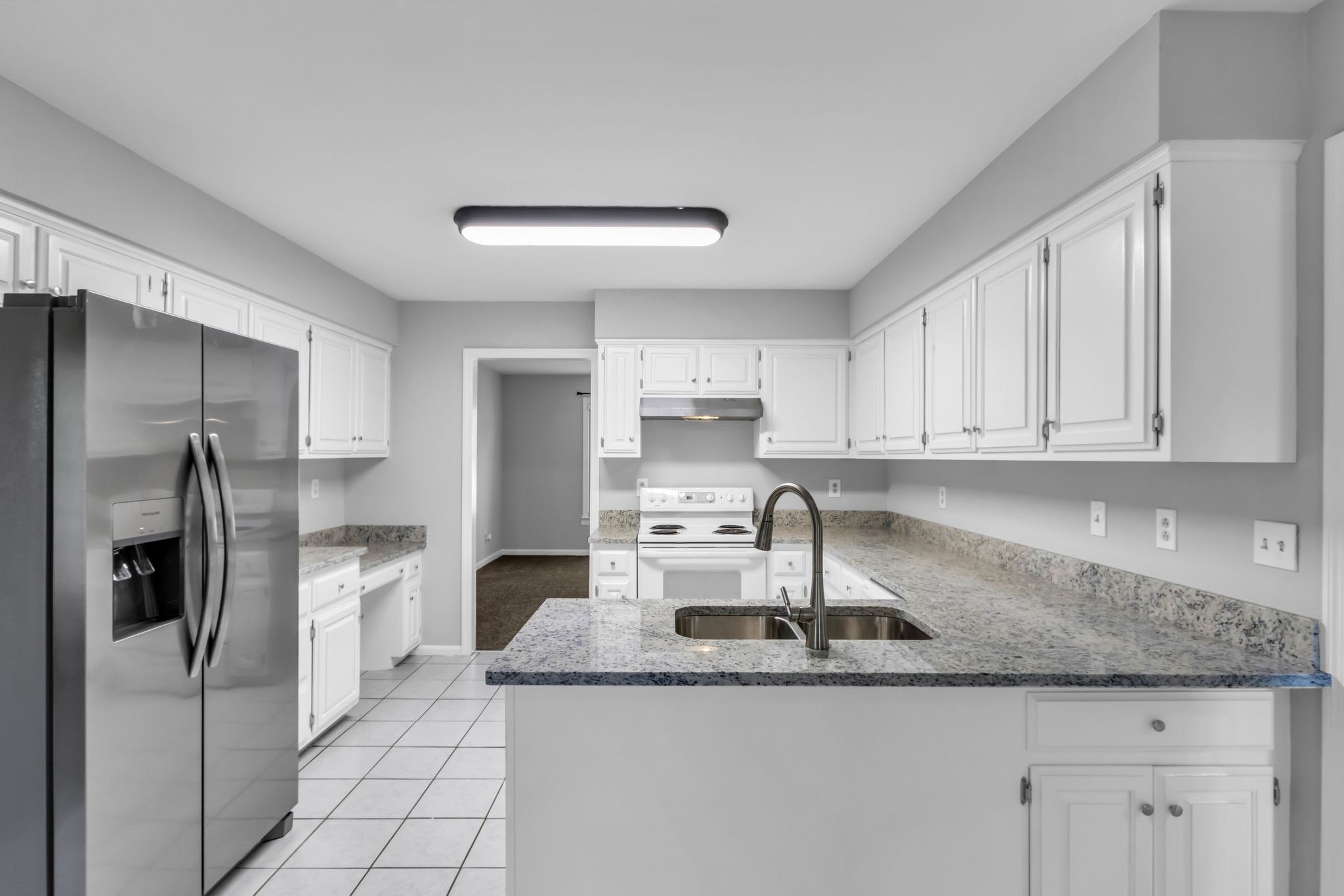 2560 Choctaw Trace Murfreesboro, TN 37129 - Photo 9 of 36 a kitchen with stainless steel appliances granite countertop a sink a refrigerator and cabinets