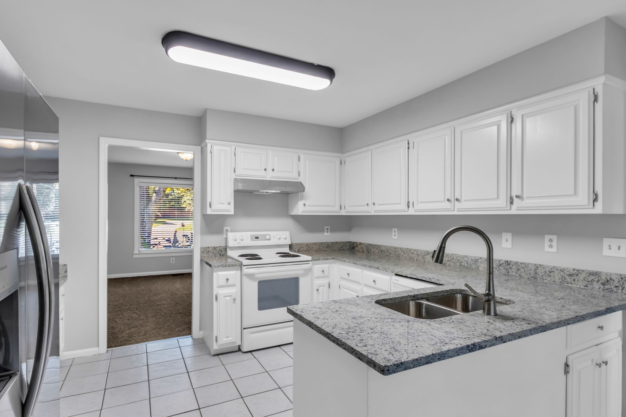 2560 Choctaw Trace Murfreesboro, TN 37129 - Photo 10 of 36 a kitchen with granite countertop a sink stainless steel appliances and cabinets