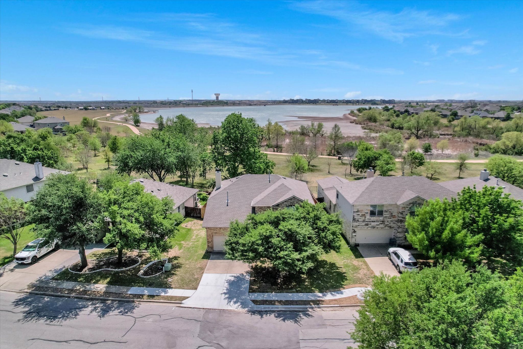 4029 Lake Edge Way Pflugerville, TX 78660 - Photo 31 of 35 Aerial view of residential area with a large body of water