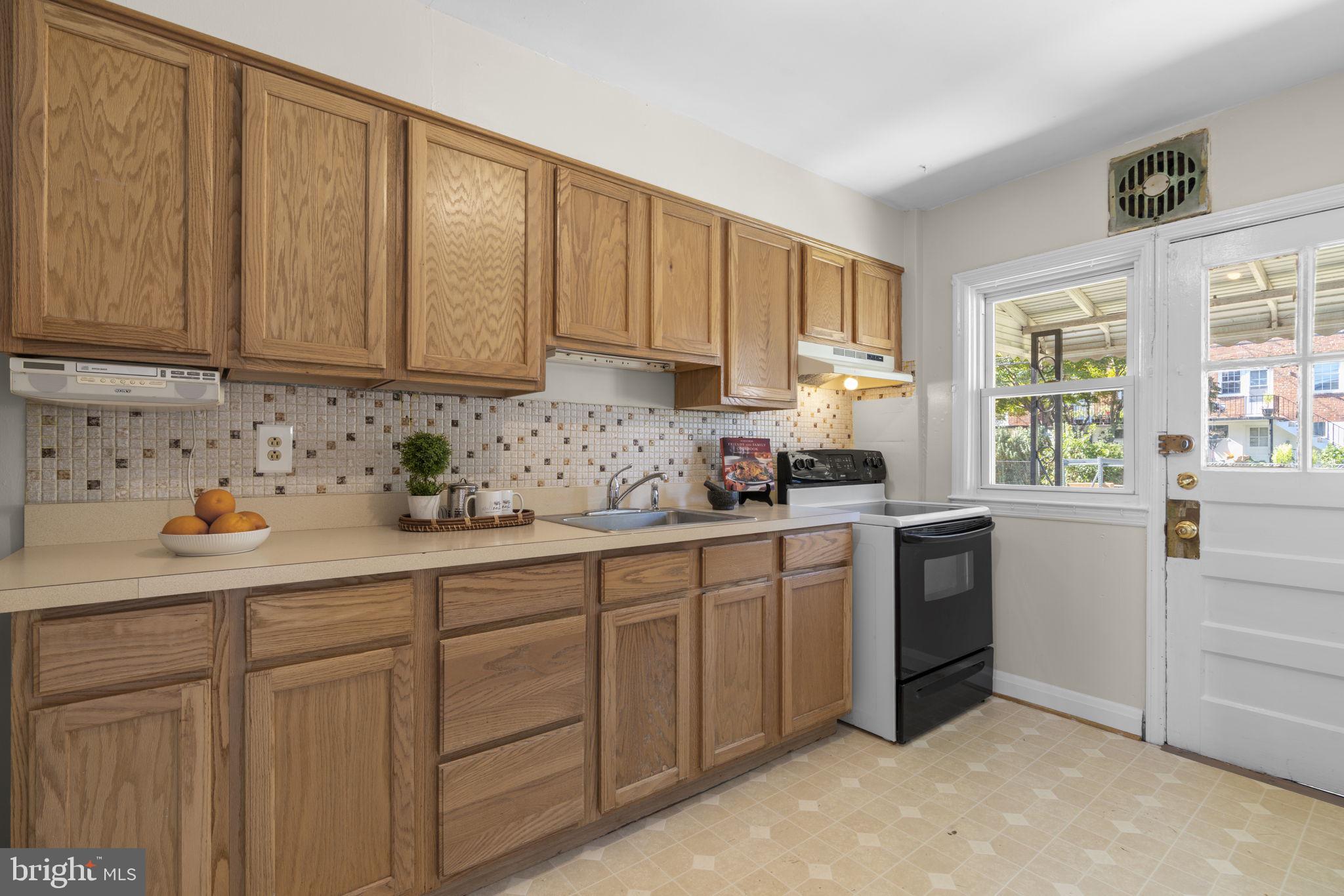 416 Stratford Road Baltimore, MD 21228 - Photo 10 of 44 Kitchen with plenty of storage, access to porch