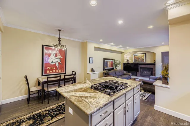 a kitchen that has a stove and a table