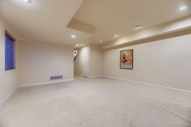 an empty room with a empty space and window