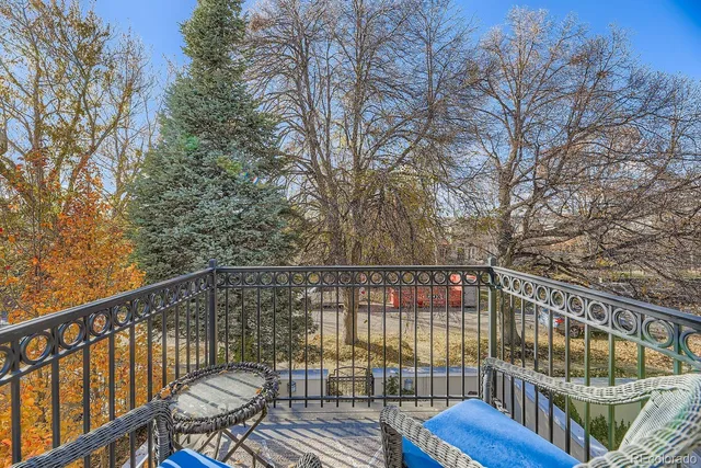 a view of balcony with wooden floor