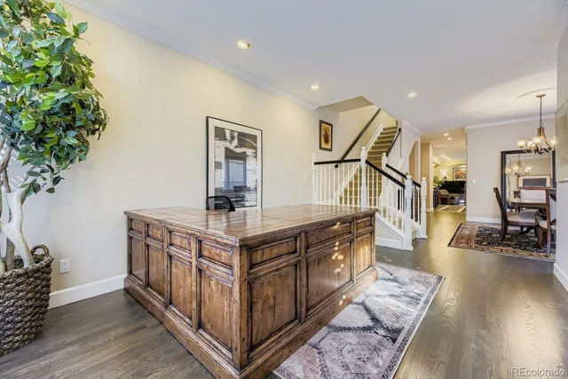 a kitchen with stainless steel appliances granite countertop a stove and a wooden floors