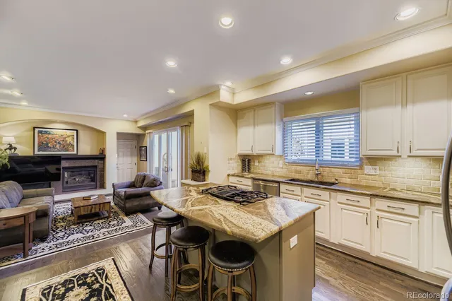 a kitchen with a stove a sink and a refrigerator