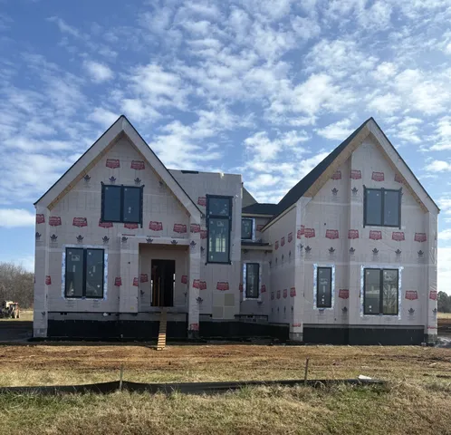 a front view of a house with garage