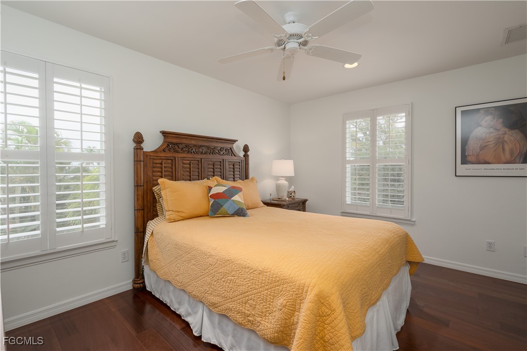 8550 Ebbtide Way Bokeelia, FL 33922 - Photo 22 of 50 a bedroom with a large bed and a window