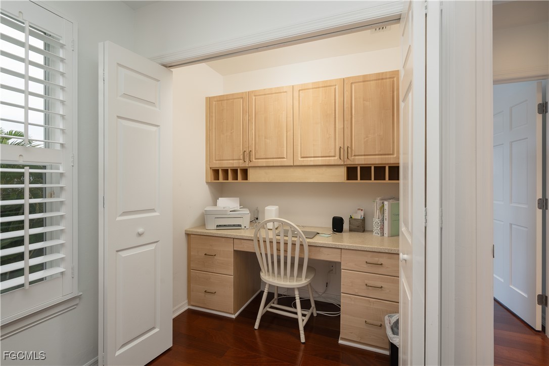 8550 Ebbtide Way Bokeelia, FL 33922 - Photo 24 of 50 a view of a workspace with wooden floor and a window