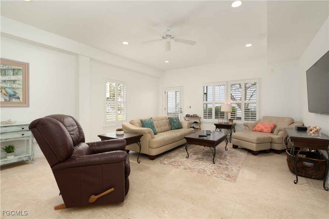 8550 Ebbtide Way Bokeelia, FL 33922 - Photo 30 of 50 a living room with furniture and a large window