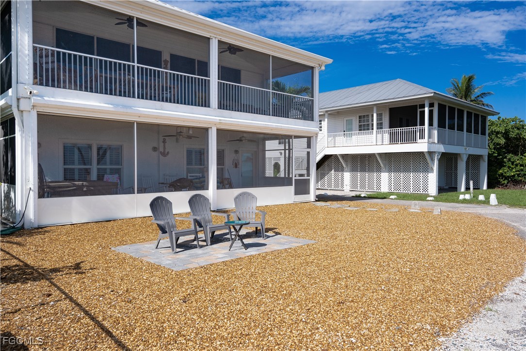 8550 Ebbtide Way Bokeelia, FL 33922 - Photo 35 of 50 a house view with a outdoor space