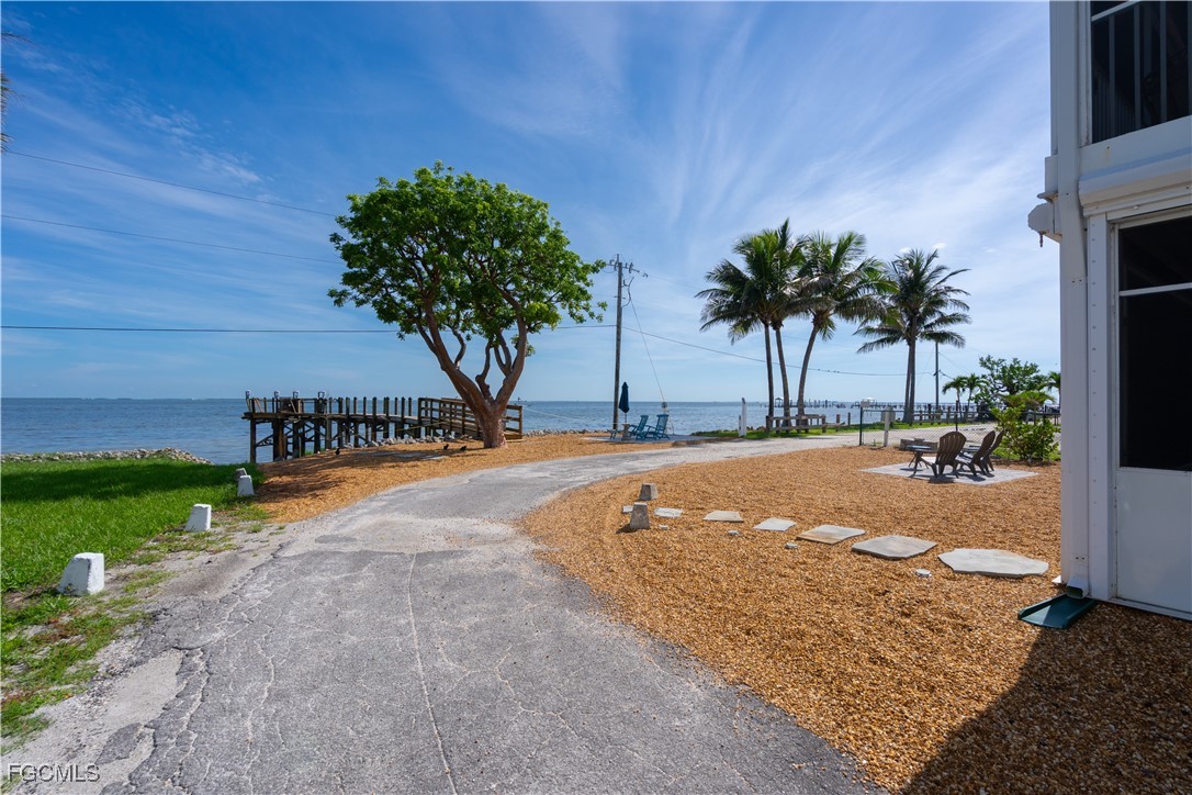 8550 Ebbtide Way Bokeelia, FL 33922 - Photo 36 of 50 a view of a swimming pool with a yard