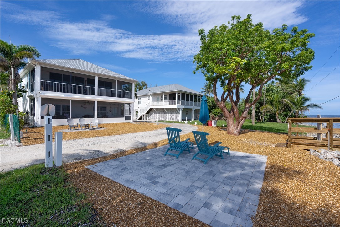 8550 Ebbtide Way Bokeelia, FL 33922 - Photo 37 of 50 a view of a house with pool and sitting area