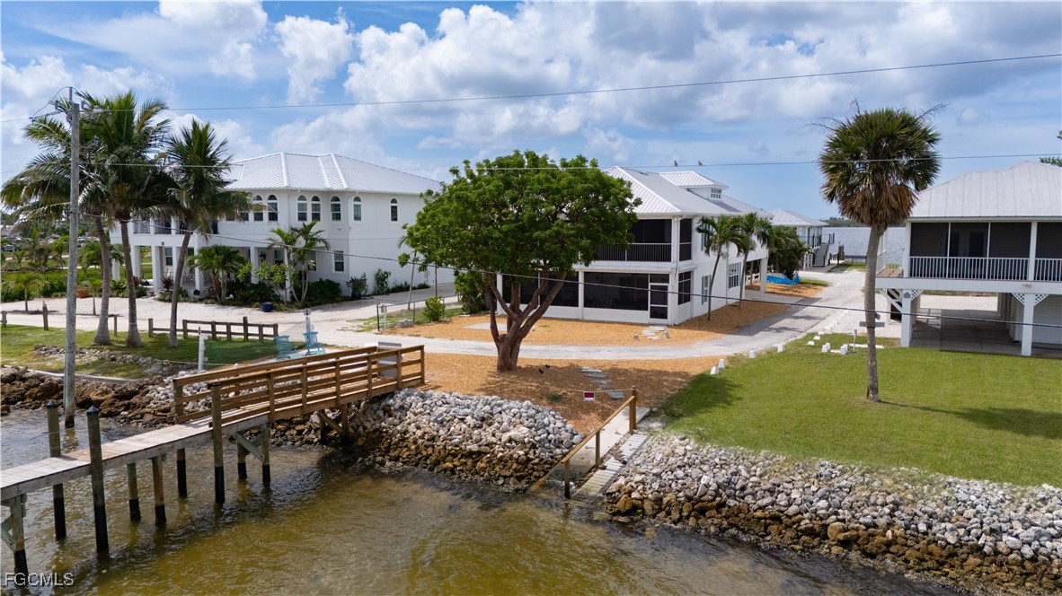 8550 Ebbtide Way Bokeelia, FL 33922 - Photo 40 of 50 a view of a swimming pool with a patio
