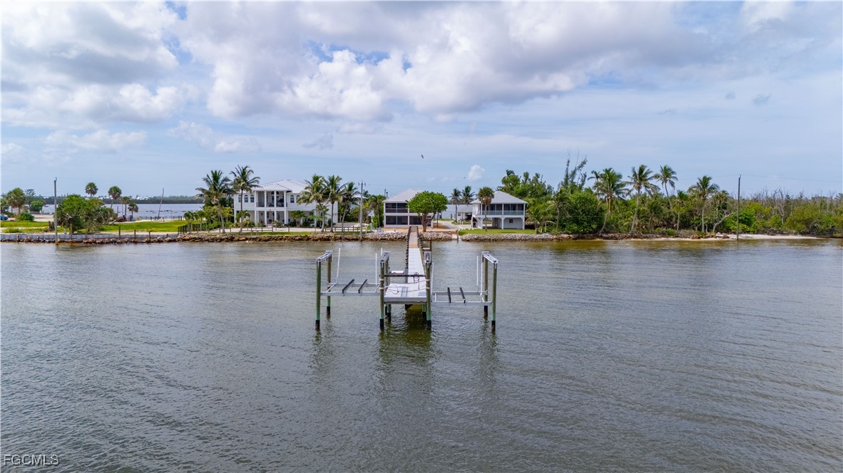 8550 Ebbtide Way Bokeelia, FL 33922 - Photo 45 of 50 a view of a lake with houses in the back