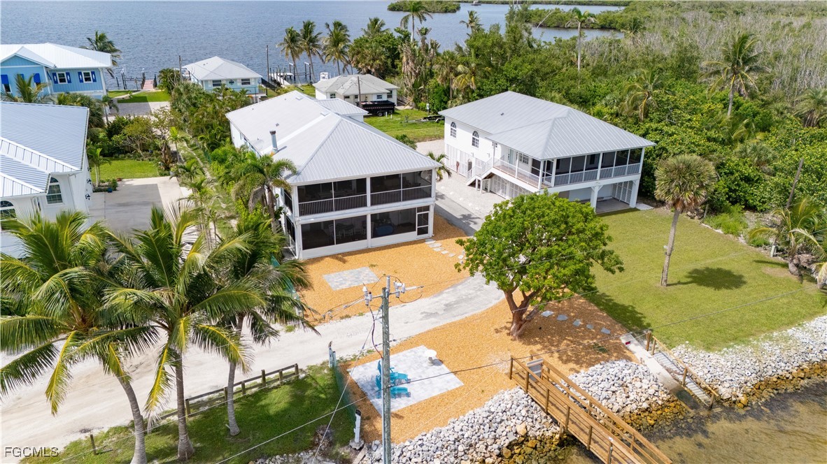 8550 Ebbtide Way Bokeelia, FL 33922 - Photo 6 of 50 an aerial view of a house