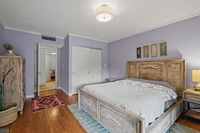 a bedroom with a bed and a walk in closet