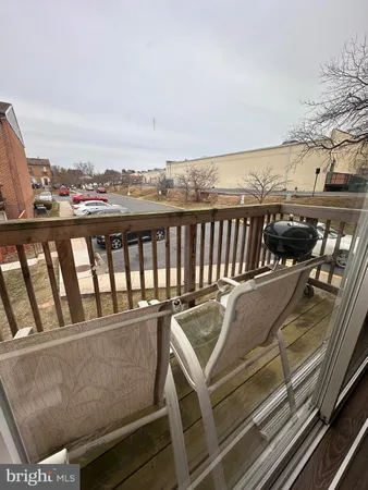 a view of a balcony with wooden floor