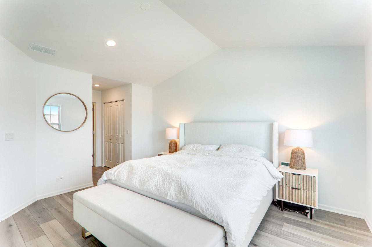 204 Timberleaf Circle Roselle, IL 60172 - Photo 16 of 22 a bedroom with a bed and wooden floor