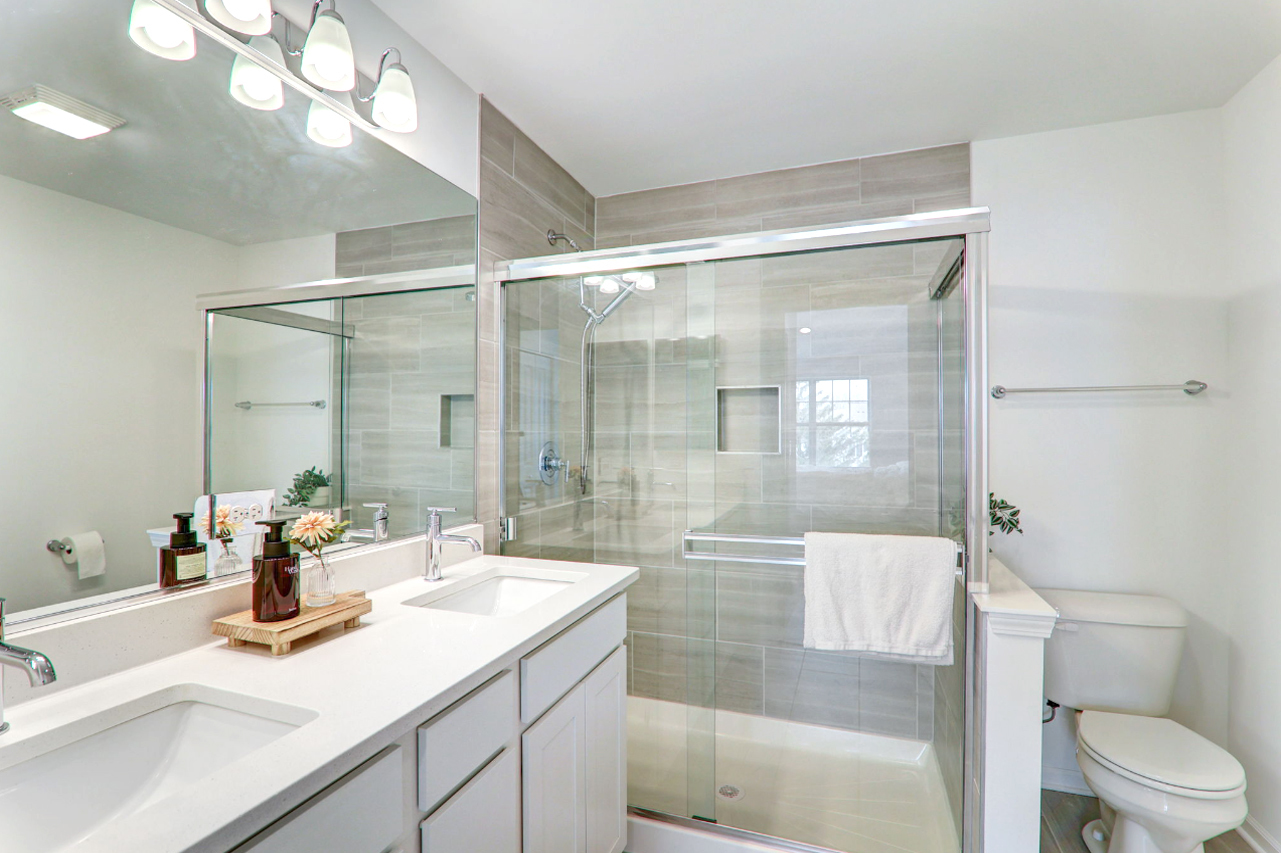204 Timberleaf Circle Roselle, IL 60172 - Photo 17 of 22 a bathroom with a sink vanity granite toilet and shower