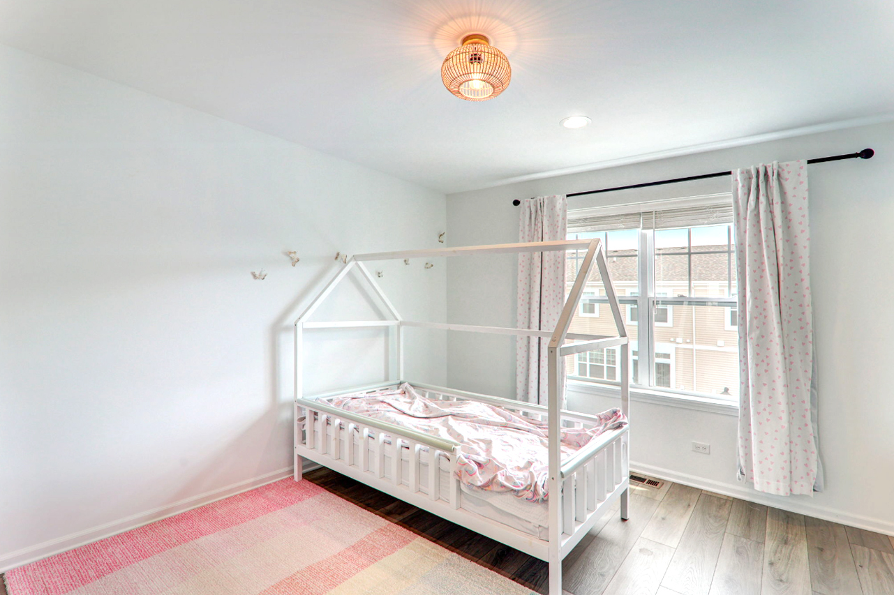 204 Timberleaf Circle Roselle, IL 60172 - Photo 18 of 22 a bedroom with a bed and a window