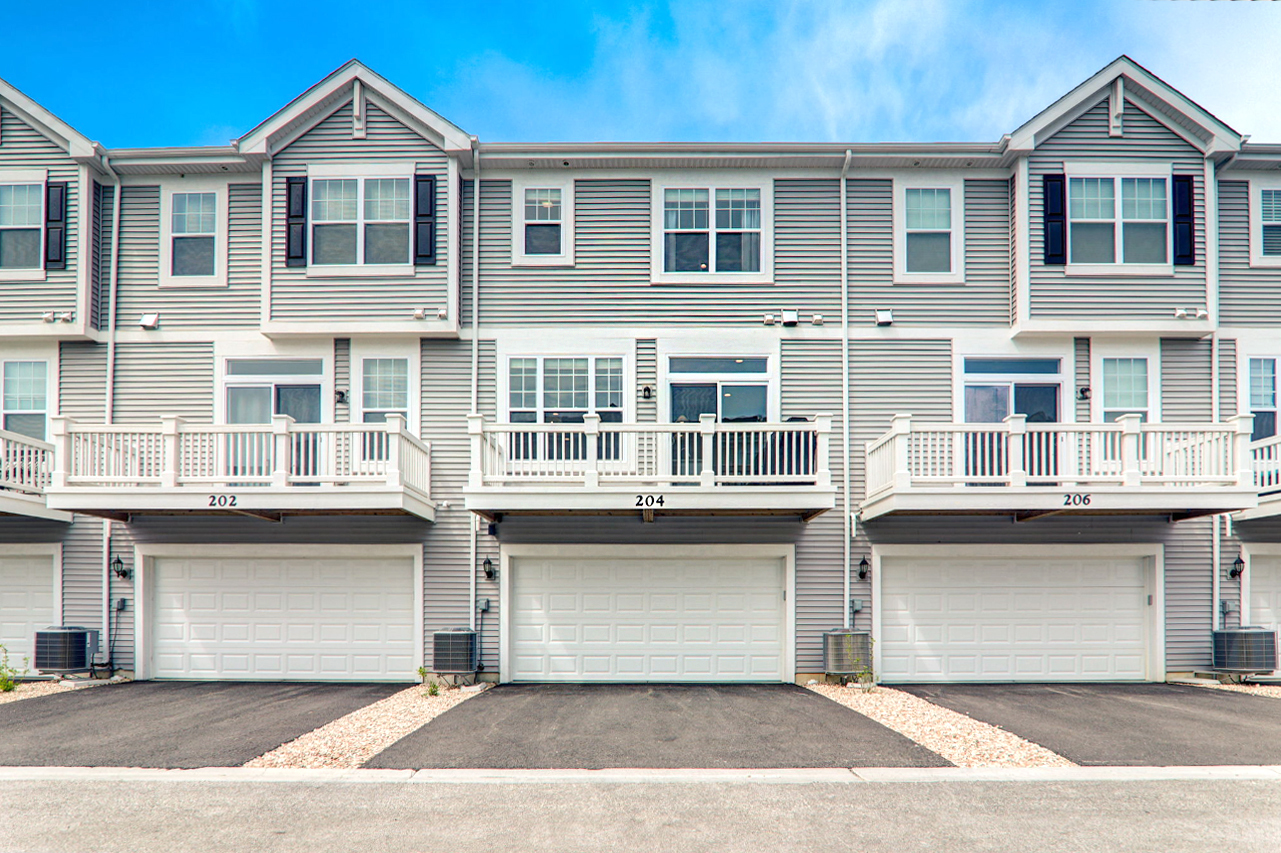 204 Timberleaf Circle Roselle, IL 60172 - Photo 21 of 22 a front view of residential houses with yard