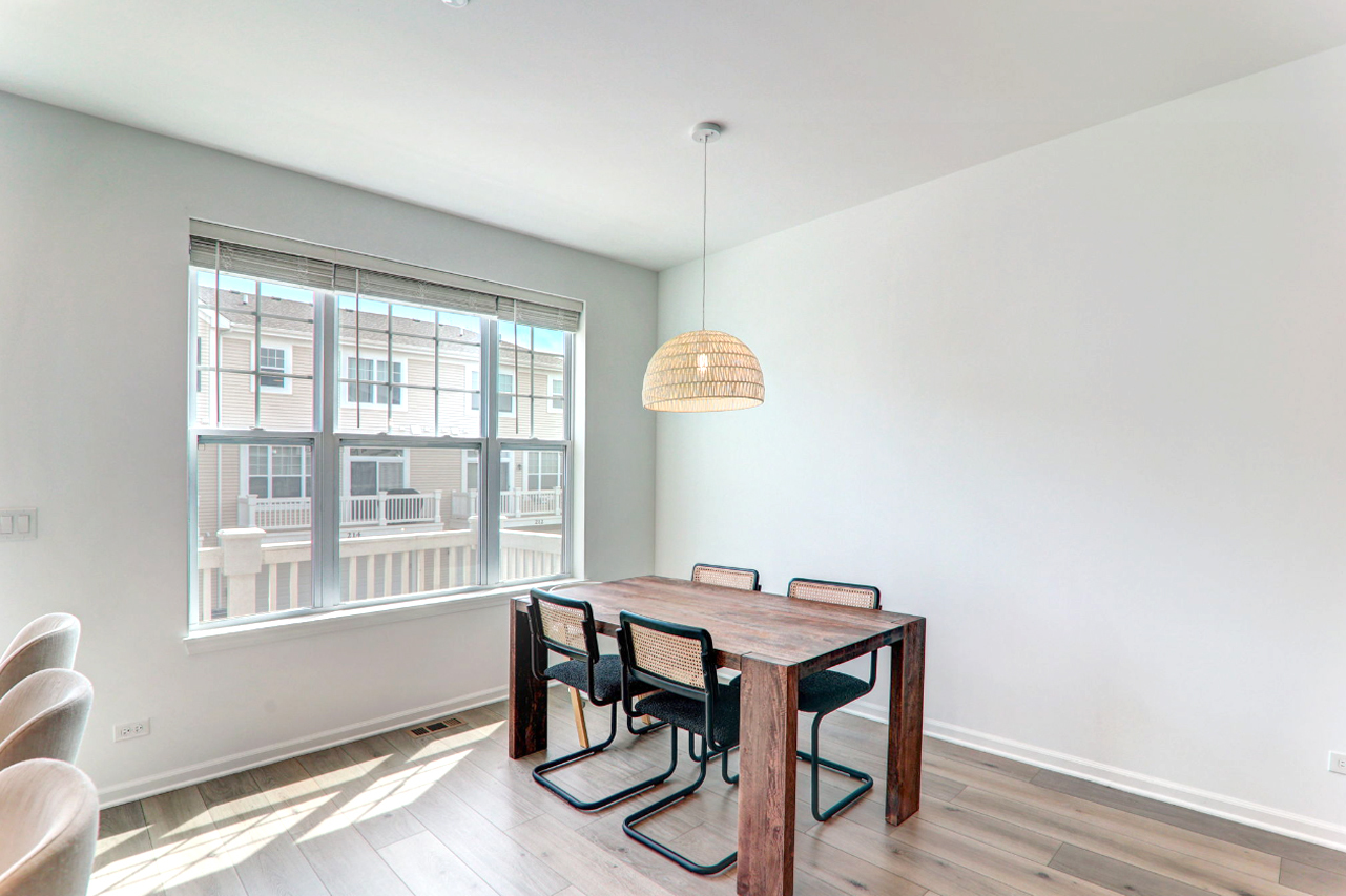 204 Timberleaf Circle Roselle, IL 60172 - Photo 6 of 22 a view of a dining room with furniture window and wooden floor