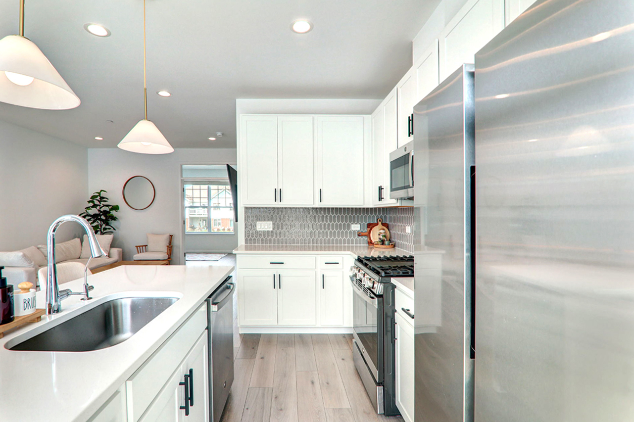 204 Timberleaf Circle Roselle, IL 60172 - Photo 9 of 22 a kitchen with a sink a counter top space stainless steel appliances and cabinets