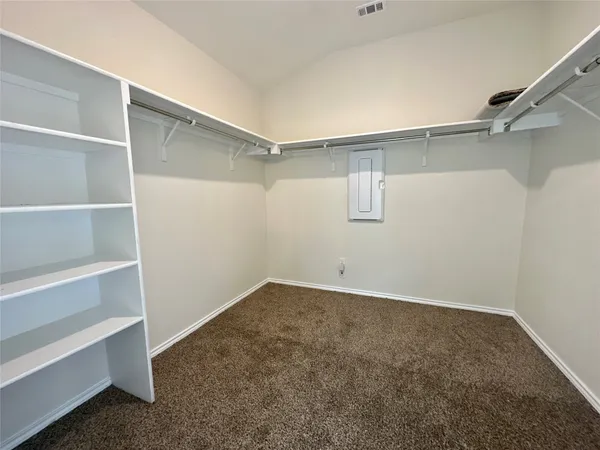 a view of an empty walk in closet
