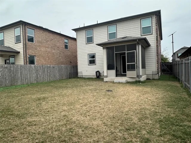 a view of a house with backyard and space