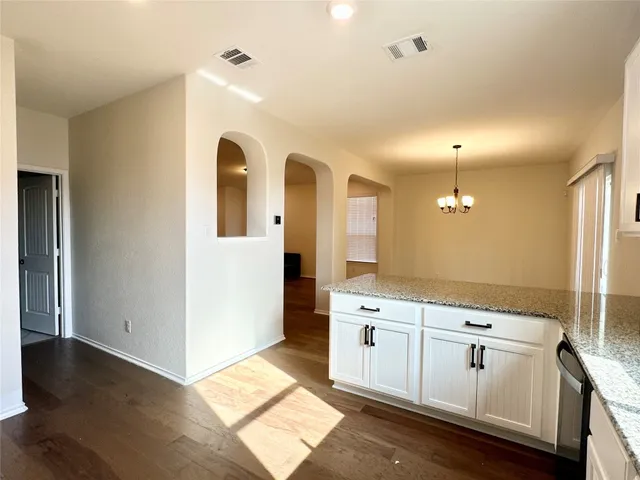 a spacious bathroom with a double vanity sink a mirror and a shower