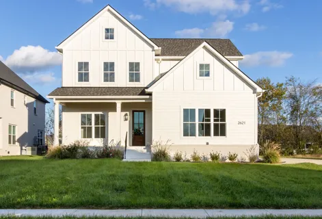 a view of a yard in front of a house with plants