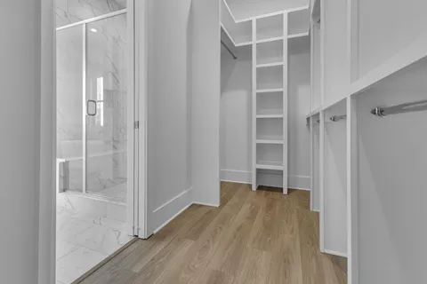 a view of an empty walk in closet