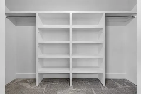 a view of a house with backyard and road