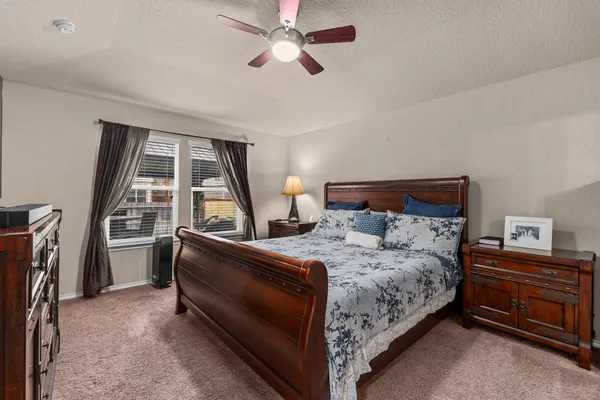 a bed room with a bed and a window