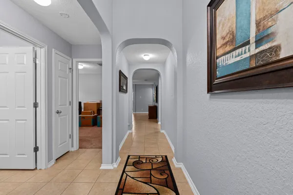 a view of a hallway view with staircase