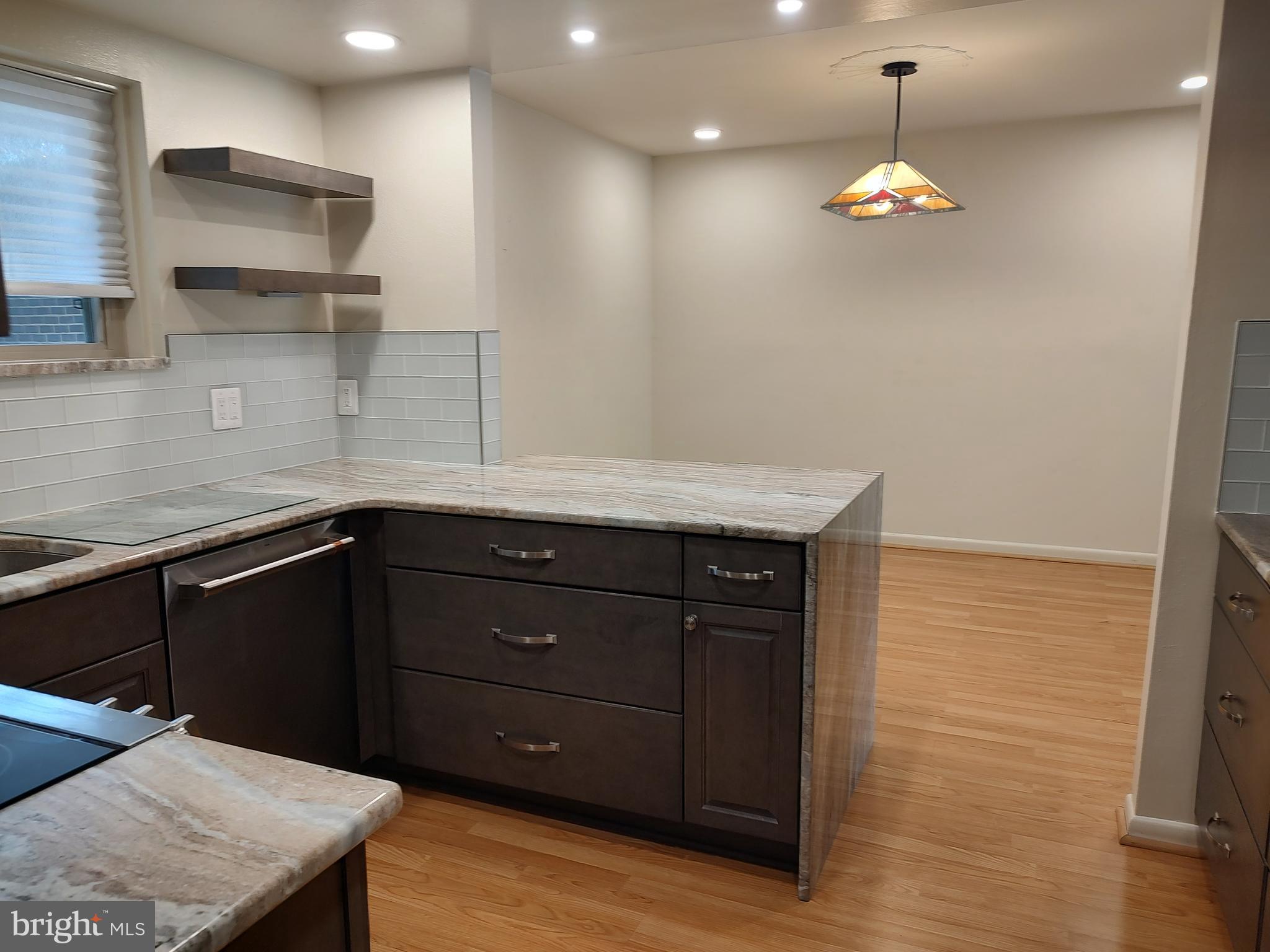 3576 Chiswick Court, Unit 342C Silver Spring, MD 20906 - Photo 2 of 16 Granite Counters and recessed lighting