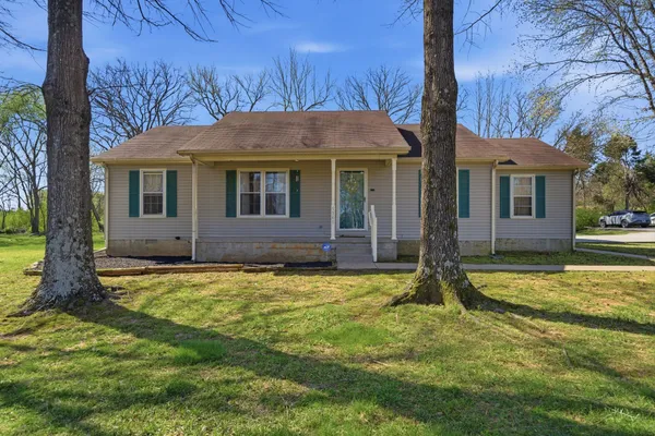 a house with trees in the background