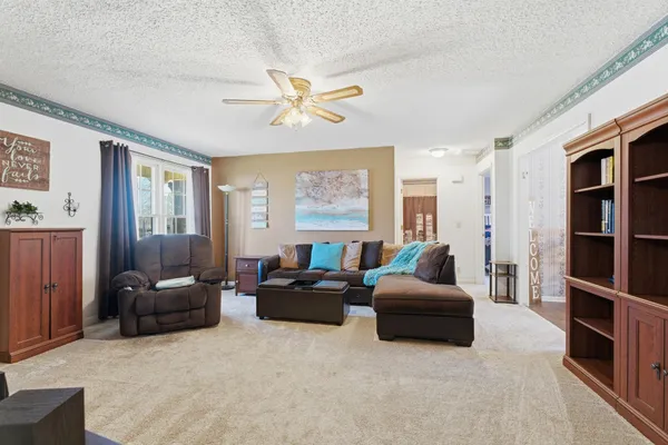 a living room with furniture and a window