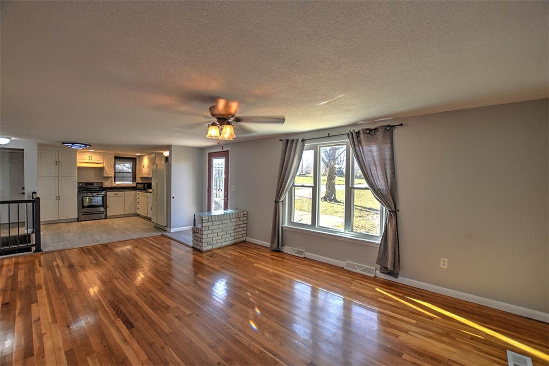 3970 Mount Zion Road Decatur, IL 62521 - Photo 10 of 36 wooden floor in an empty room with a window