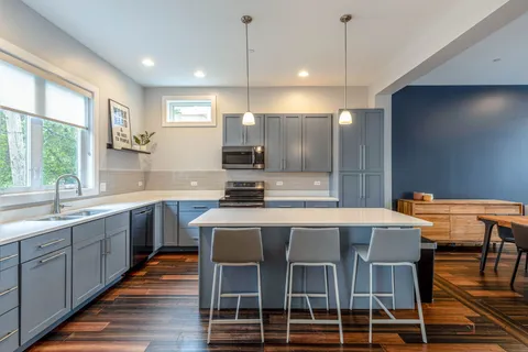 a kitchen with granite countertop a sink and counter space