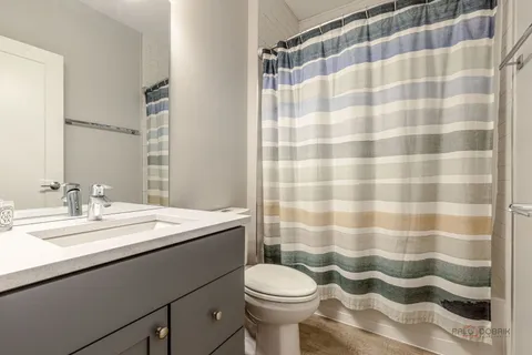 a bathroom with a sink and mirror