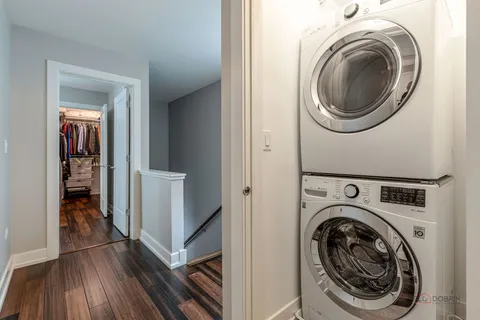 a view of a hallway with washer and dryer