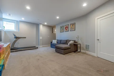 a living room with furniture and a lamp