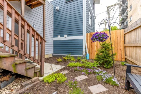 a view of a pathway along with potted plants