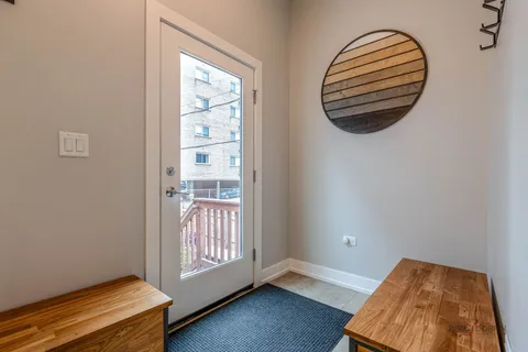 a view of a room with wooden floor and windows