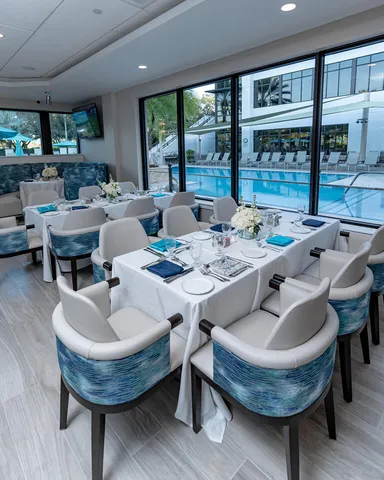 a table with wine bottles and glasses on it